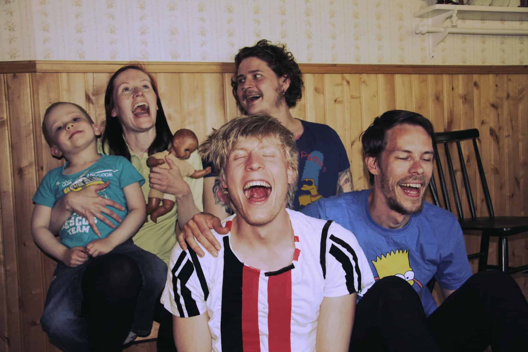 Carlos and siblings pretending to laugh hysterically, 2018.