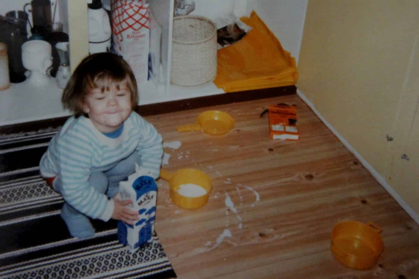 Carlos Eriksson as a toddler, making a mess in his mom's kitchen.